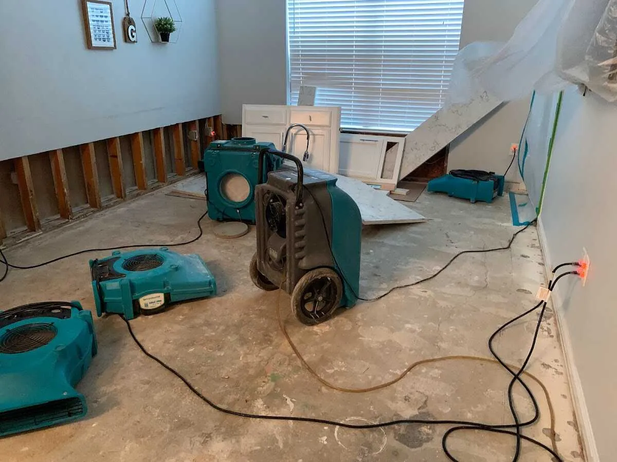 Dehumidifier in flood-cut room for Water Damage Restoration in Conley
